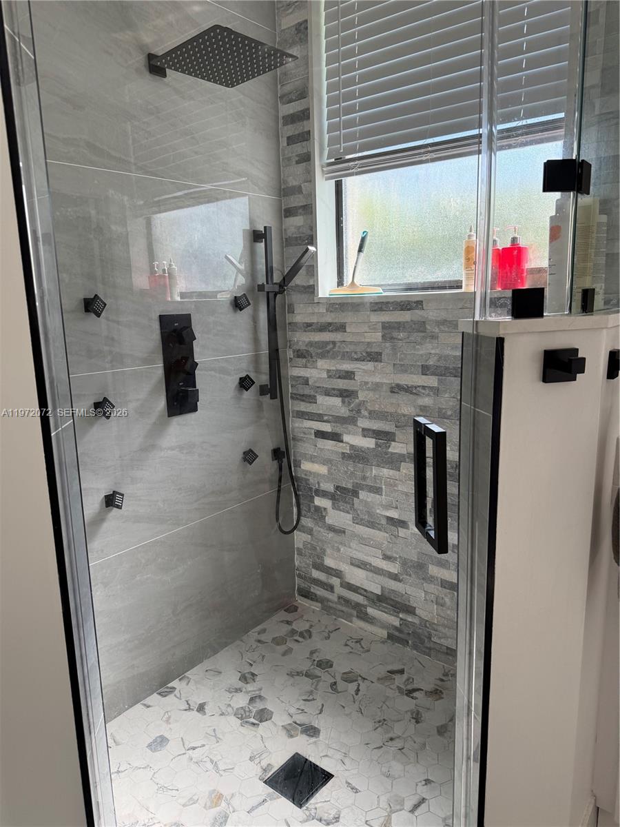 18610 Southwest 39th Court Miramar, FL 33029 - Photo 18 of 32 a bathroom with a sink and a shower