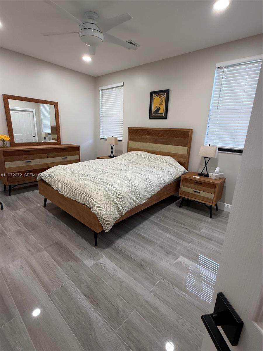 18610 Southwest 39th Court Miramar, FL 33029 - Photo 29 of 32 a bedroom with a large bed and a window