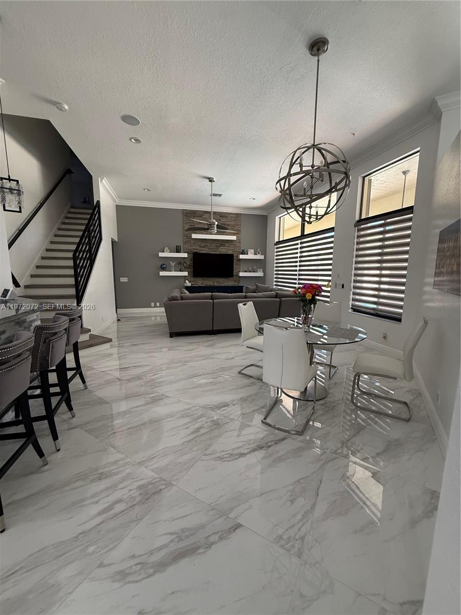 18610 Southwest 39th Court Miramar, FL 33029 - Photo 5 of 32 a view of a kitchen with furniture wooden floor and windows