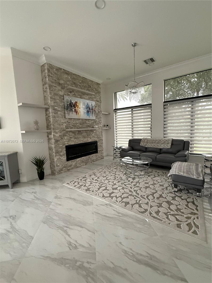 18610 Southwest 39th Court Miramar, FL 33029 - Photo 6 of 32 a living room with furniture window and a fireplace
