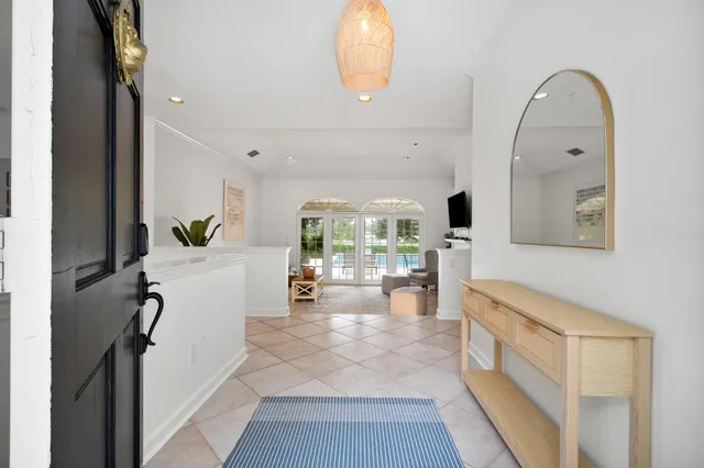 a kitchen with white cabinets appliances a sink and dishwasher