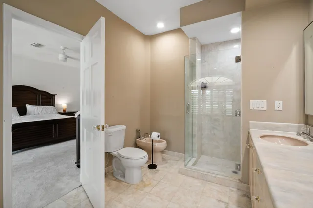 a bed sitting in a bedroom next to a window