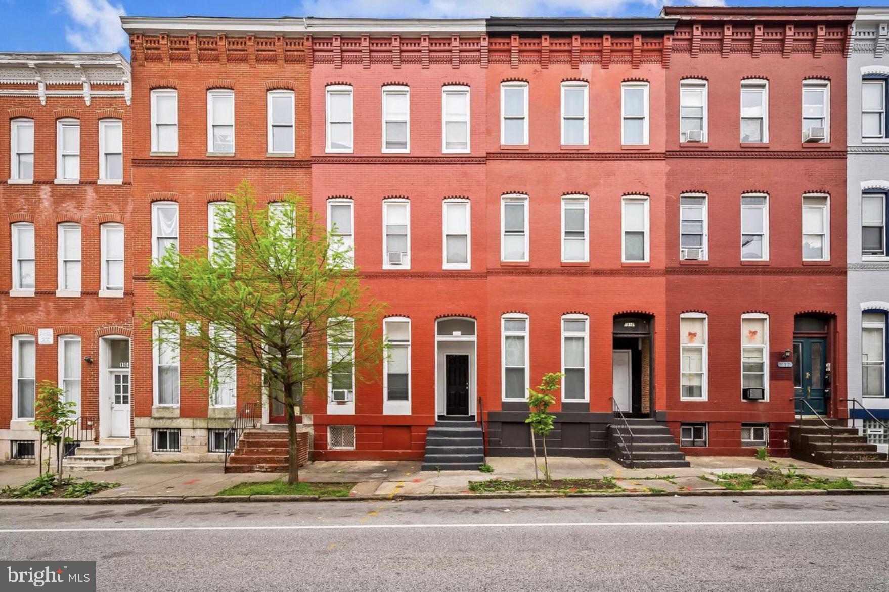 a front view of a building with street view