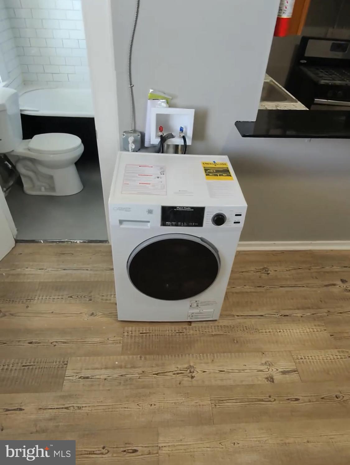 1908 McCulloh Street Baltimore, MD 21217 - Photo 18 of 40 a utility room with a washing machine