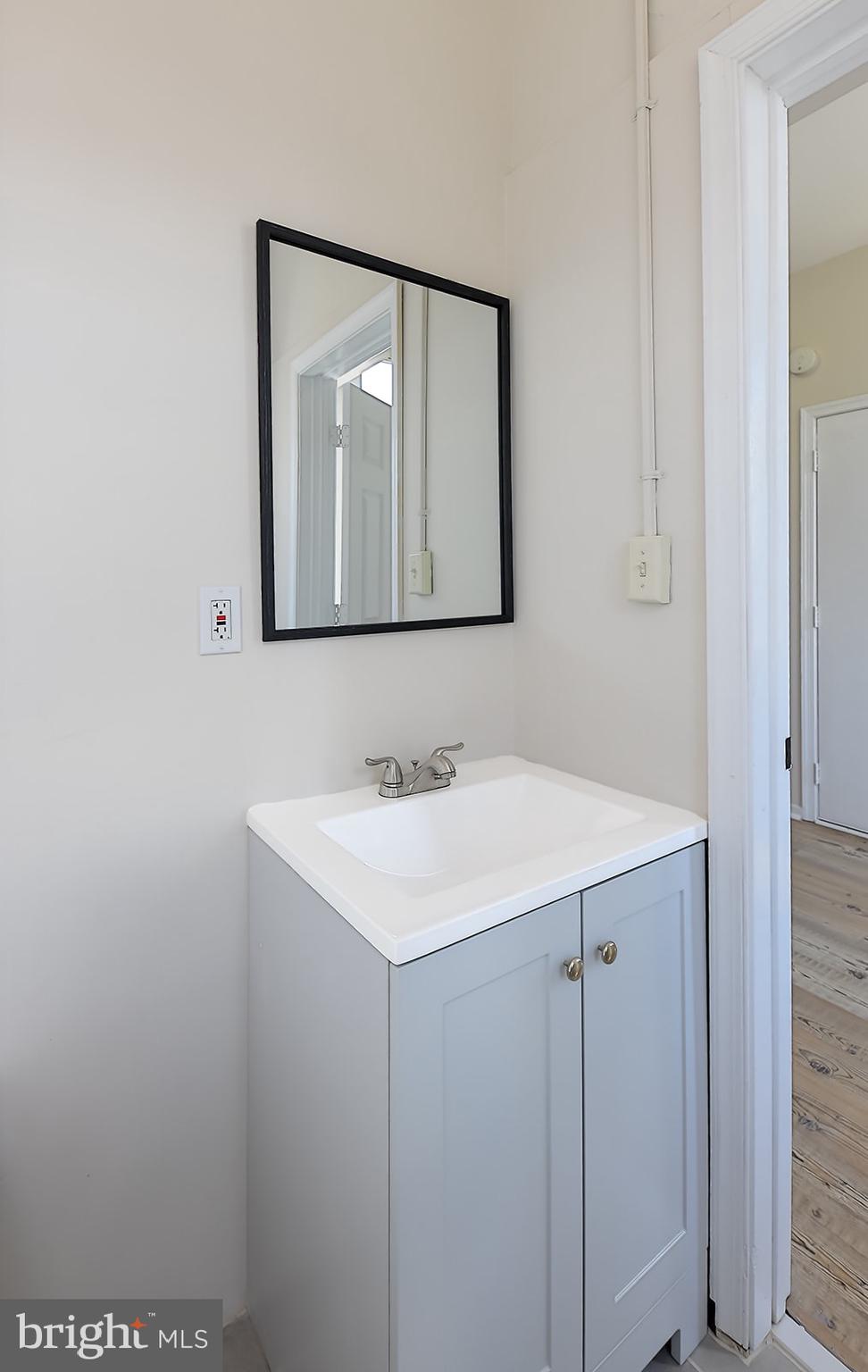 1908 McCulloh Street Baltimore, MD 21217 - Photo 32 of 40 a bathroom with a sink and a mirror