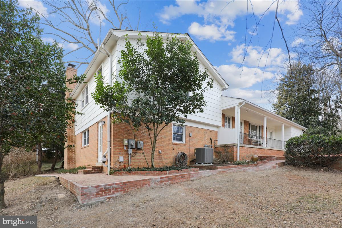 12145 Stirrup Road Reston, VA 20191 - Photo 11 of 80 a front view of a house with a yard