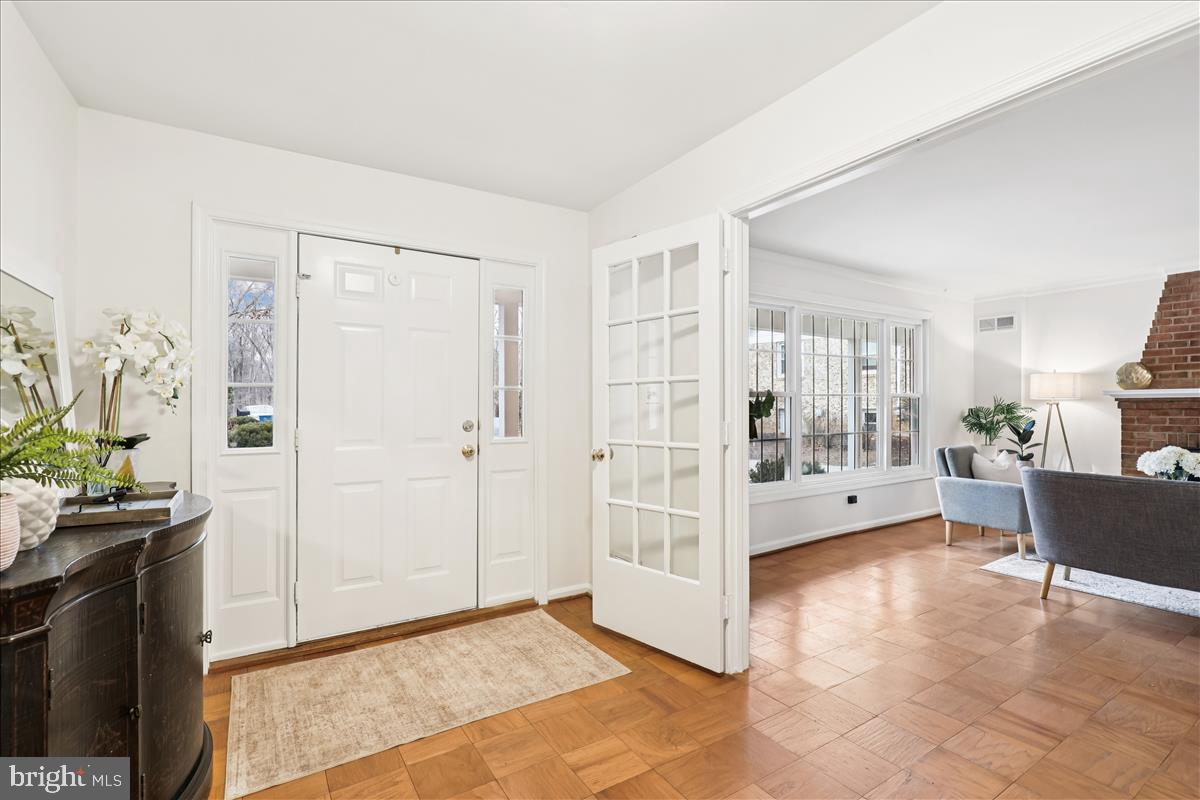 12145 Stirrup Road Reston, VA 20191 - Photo 15 of 80 a view of a livingroom with wooden floor and furniture