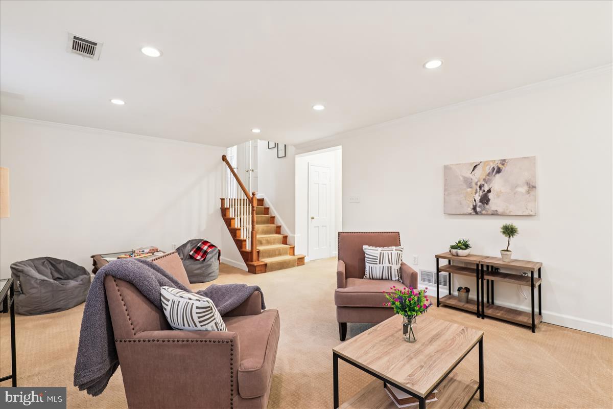 12145 Stirrup Road Reston, VA 20191 - Photo 17 of 80 a living room with furniture and a wooden floor