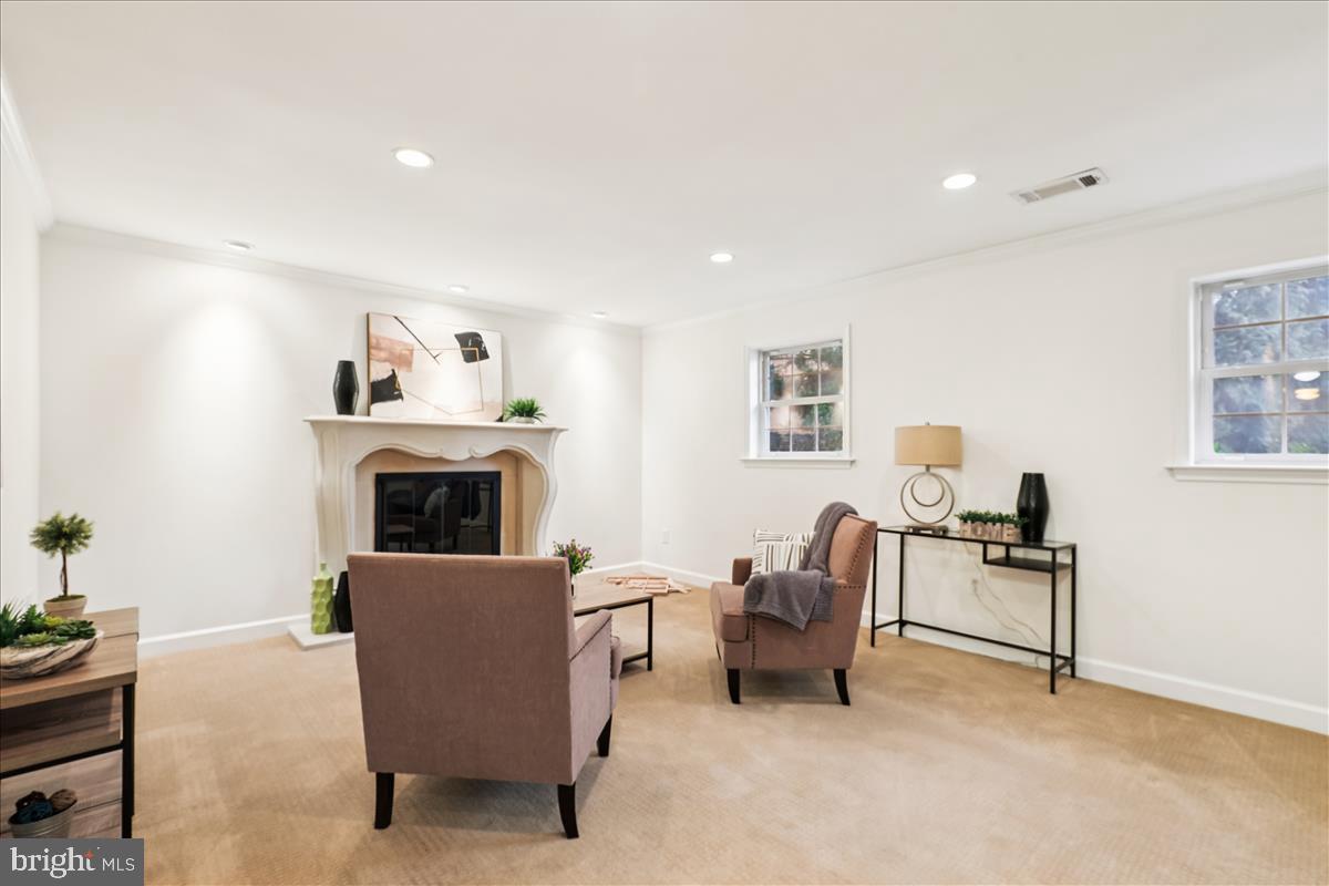 12145 Stirrup Road Reston, VA 20191 - Photo 19 of 80 a living room with furniture and a fireplace