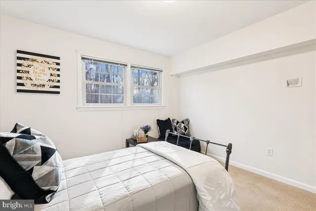 a kitchen with stainless steel appliances granite countertop a stove top oven a sink dishwasher and cabinets with wooden floor