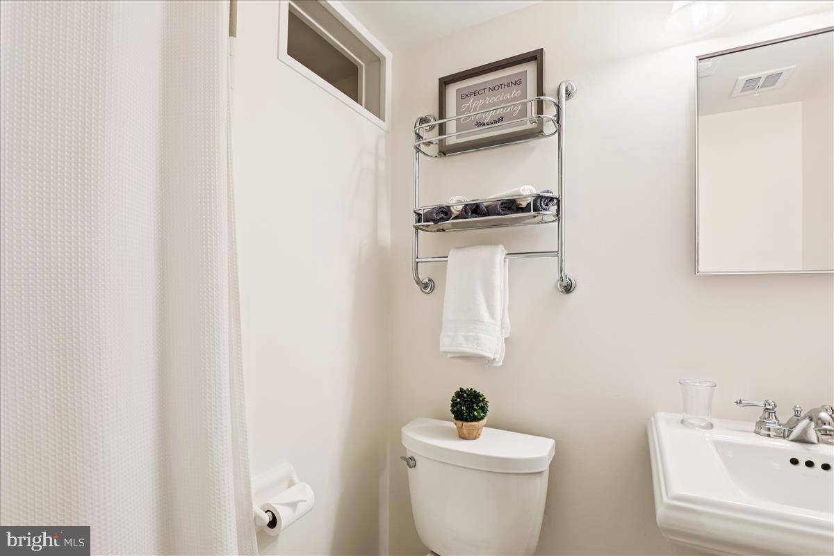 12145 Stirrup Road Reston, VA 20191 - Photo 25 of 80 a bathroom with a sink and a toilet