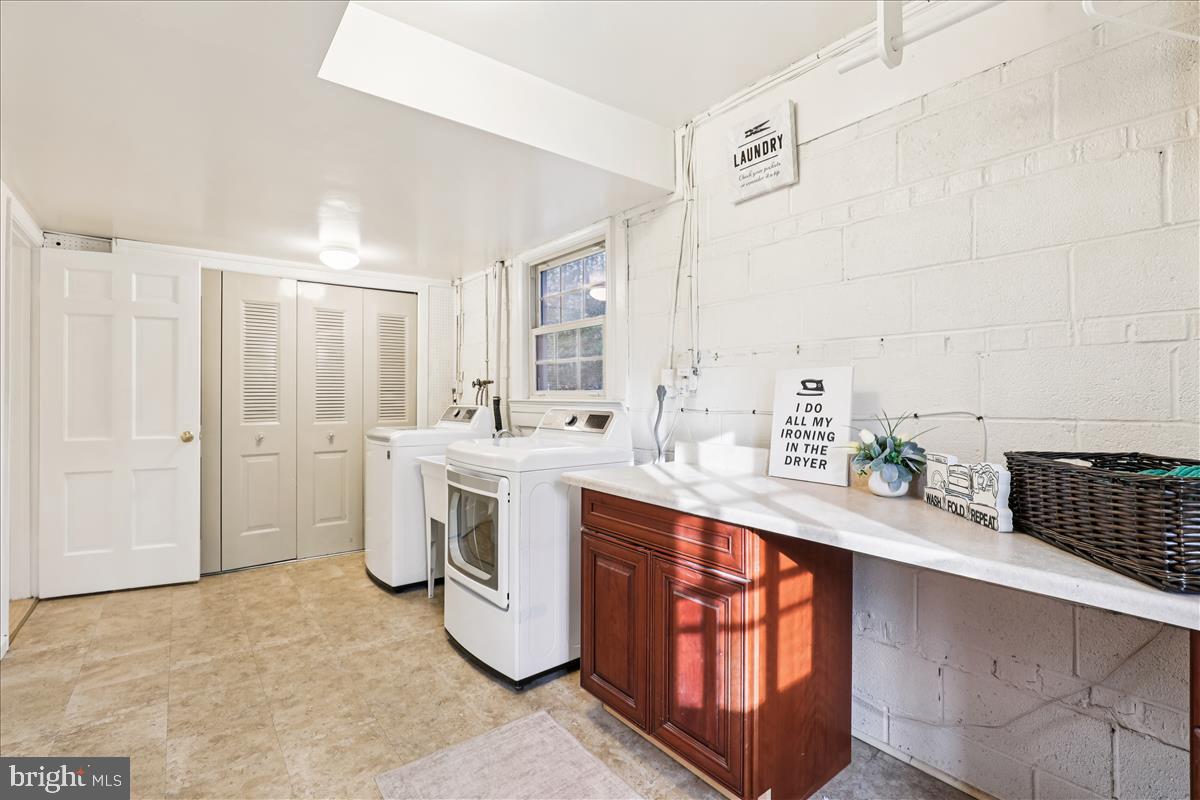 12145 Stirrup Road Reston, VA 20191 - Photo 27 of 80 a kitchen with a sink cabinets and window