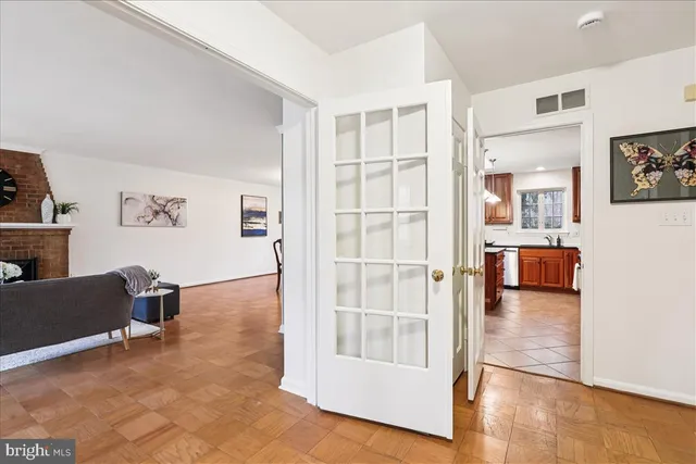 a view of a room with wooden floor
