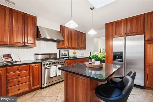 a view of a workspace room with furniture and wooden floor