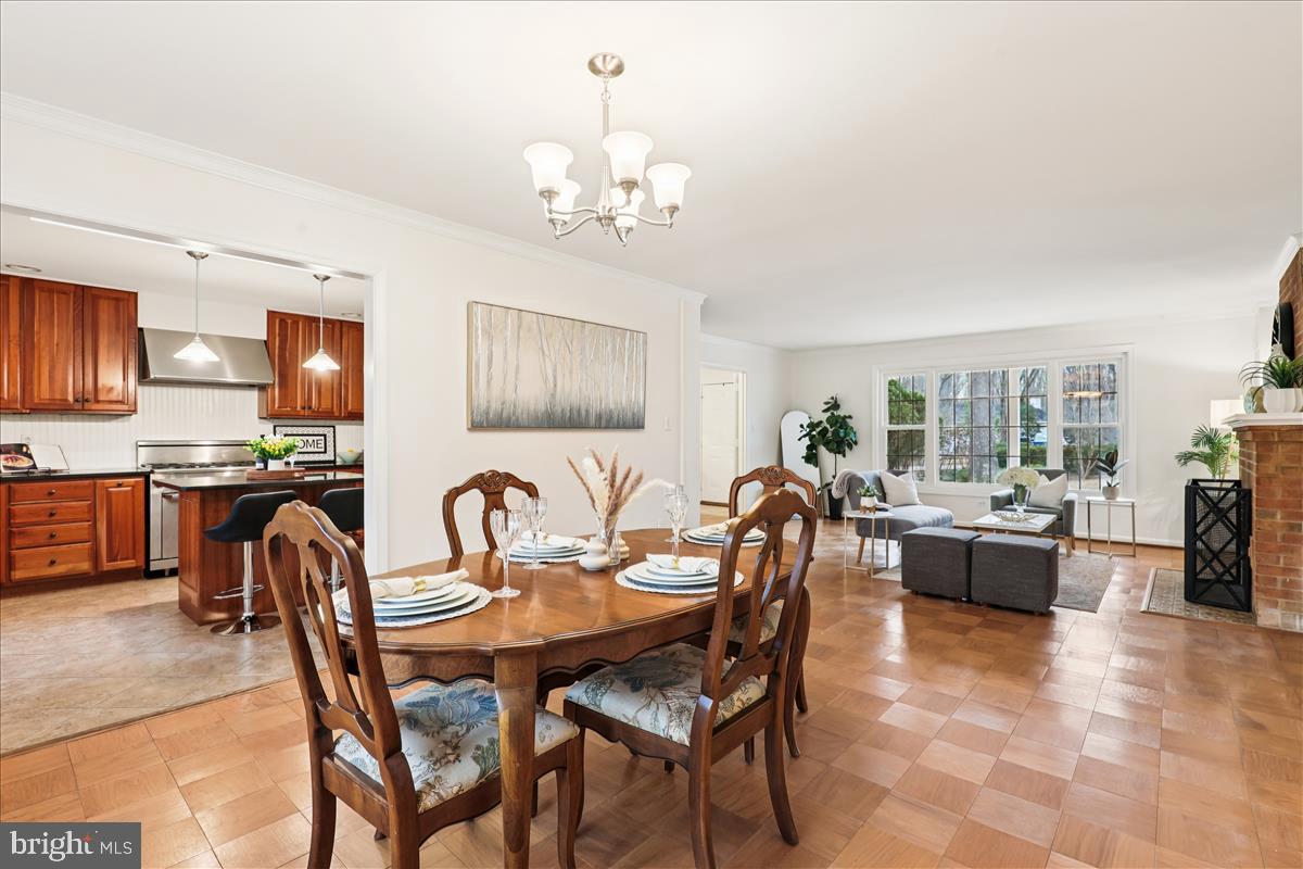 12145 Stirrup Road Reston, VA 20191 - Photo 37 of 80 a dining room with furniture a chandelier and window
