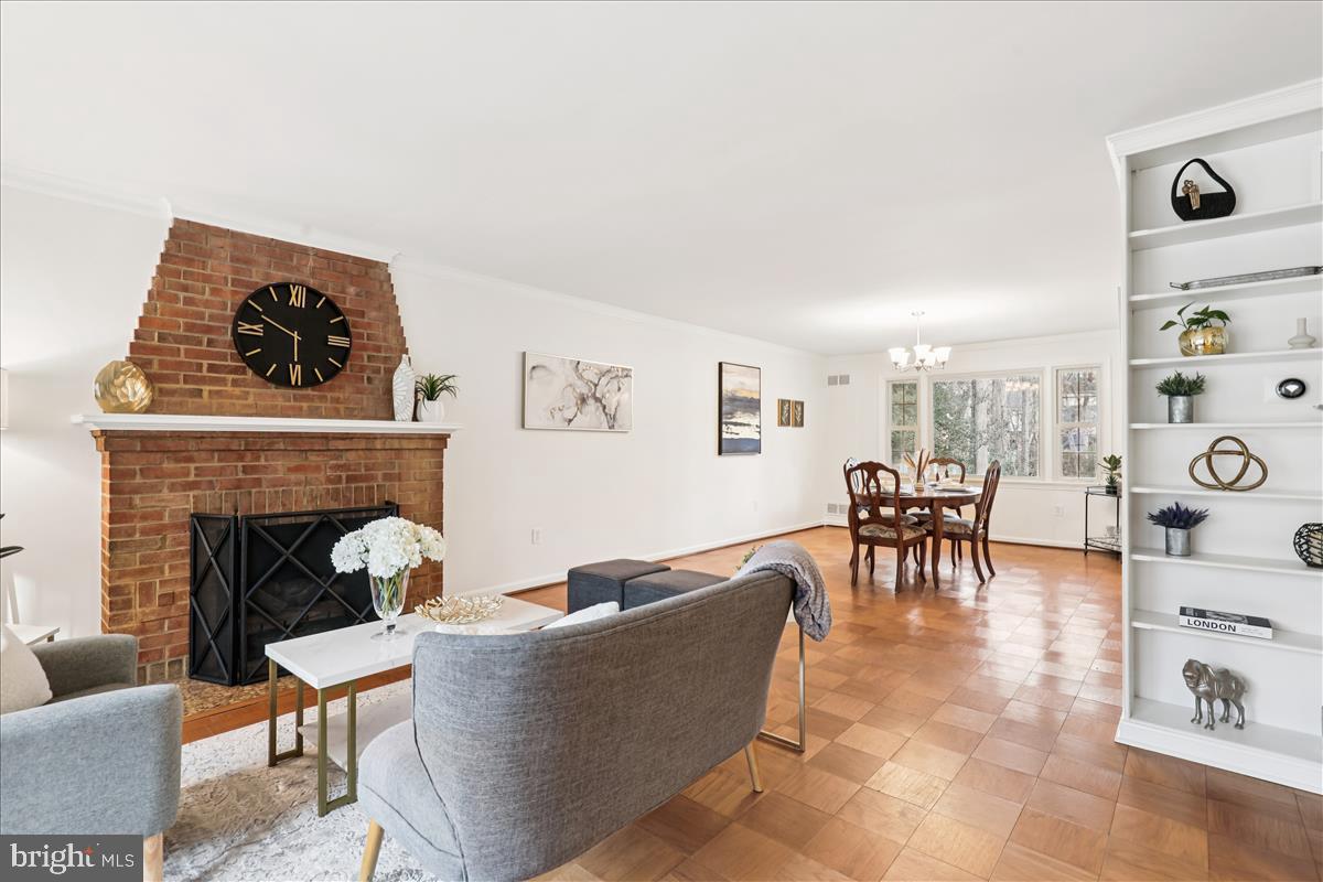 12145 Stirrup Road Reston, VA 20191 - Photo 39 of 80 a living room with furniture and a fireplace
