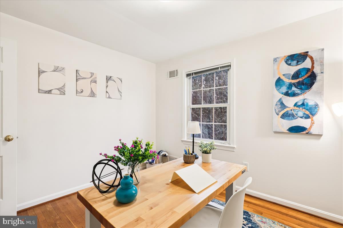 12145 Stirrup Road Reston, VA 20191 - Photo 45 of 80 a view of a workspace room with furniture and wooden floor