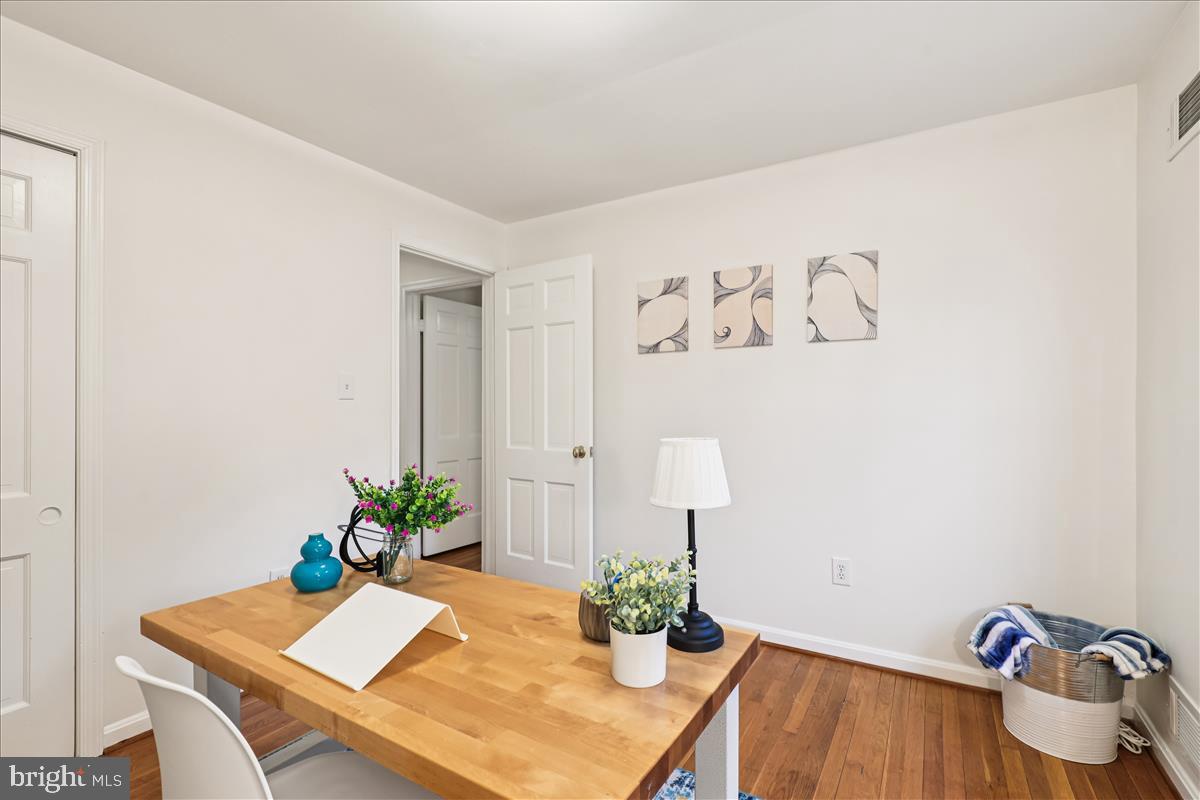 12145 Stirrup Road Reston, VA 20191 - Photo 46 of 80 a room with a table and potted plant