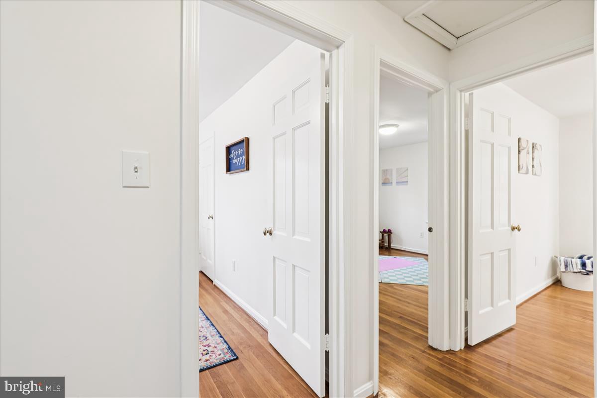 12145 Stirrup Road Reston, VA 20191 - Photo 48 of 80 a view of a hallway with wooden floor