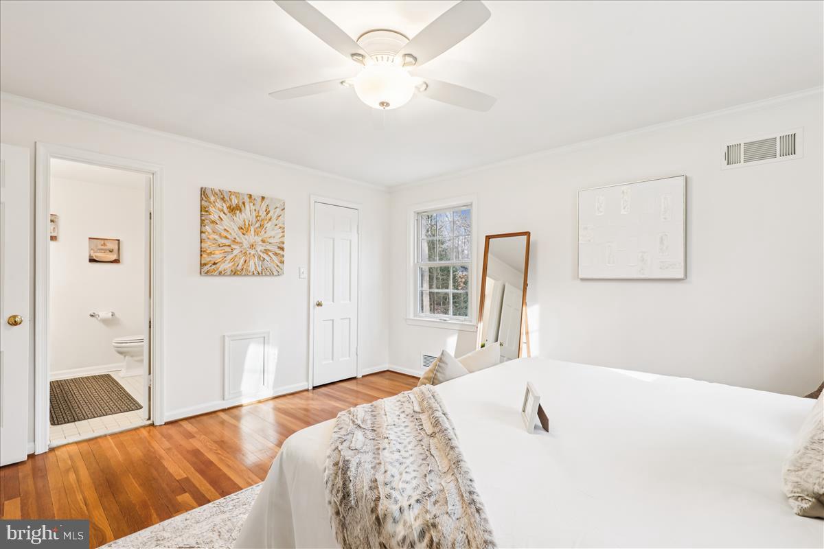 12145 Stirrup Road Reston, VA 20191 - Photo 60 of 80 a bedroom with a bed dresser and a window