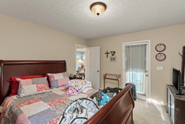 a bedroom with a bed and furniture