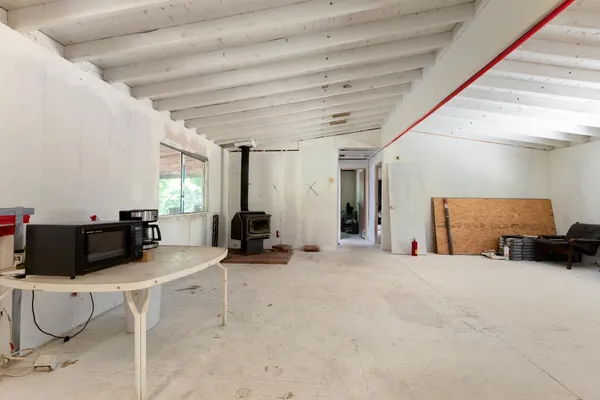 a view of a room with wooden floor
