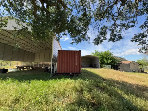 a view of a lake with a yard