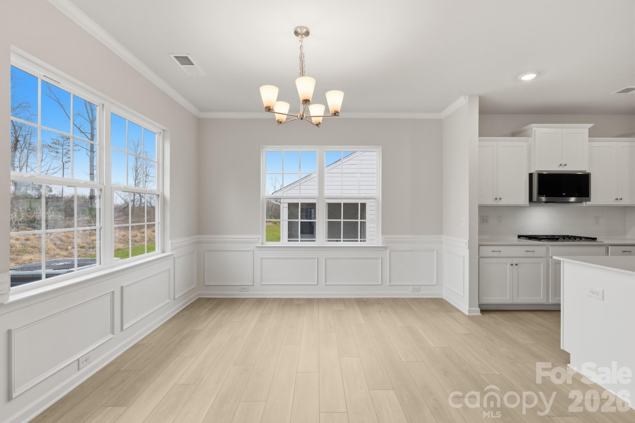 5450 Redbud Road, Unit 66 Lancaster, SC 29720 - Photo 21 of 35 a view of an empty room with a window and kitchen view