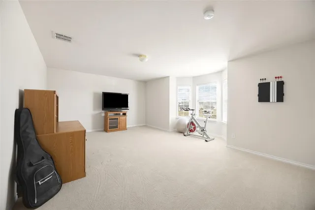 a kitchen with kitchen island granite countertop a sink cabinets and wooden floor