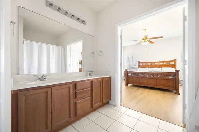 a spacious bedroom with a bed and a window