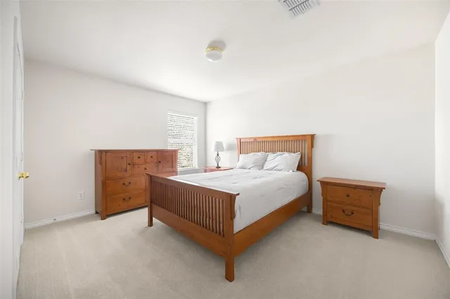 a view of a kitchen with refrigerator and stove top oven