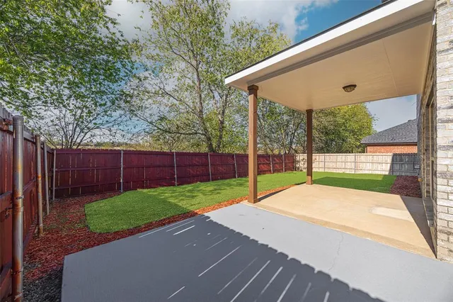a view of a hallway with washer and dryer