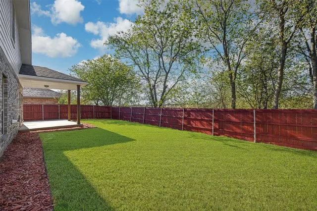 a view of a backyard with a small cabin