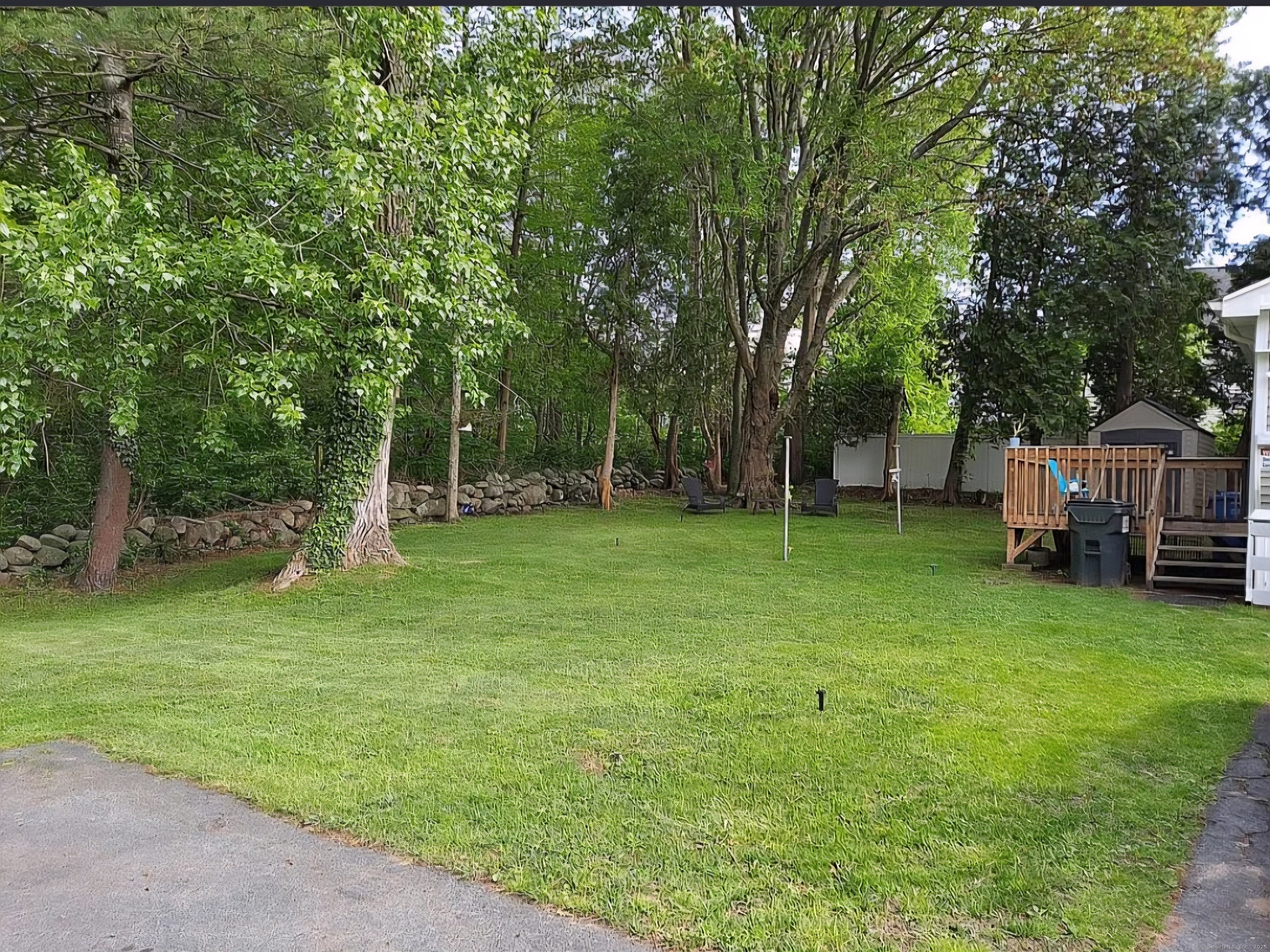 8 Cook Terrace Westbrook, CT 06498 - Photo 3 of 15 a backyard of a house with trampoline