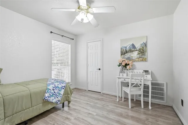a view of utility room and bedroom