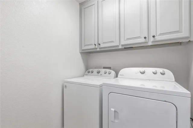 a view of empty room with windows and couch