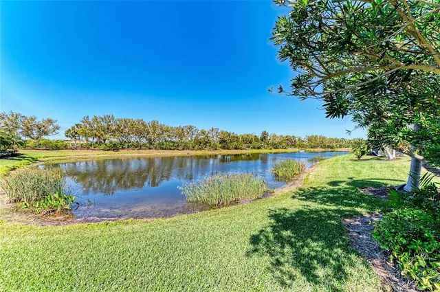 a view of a lake with a building in the background
