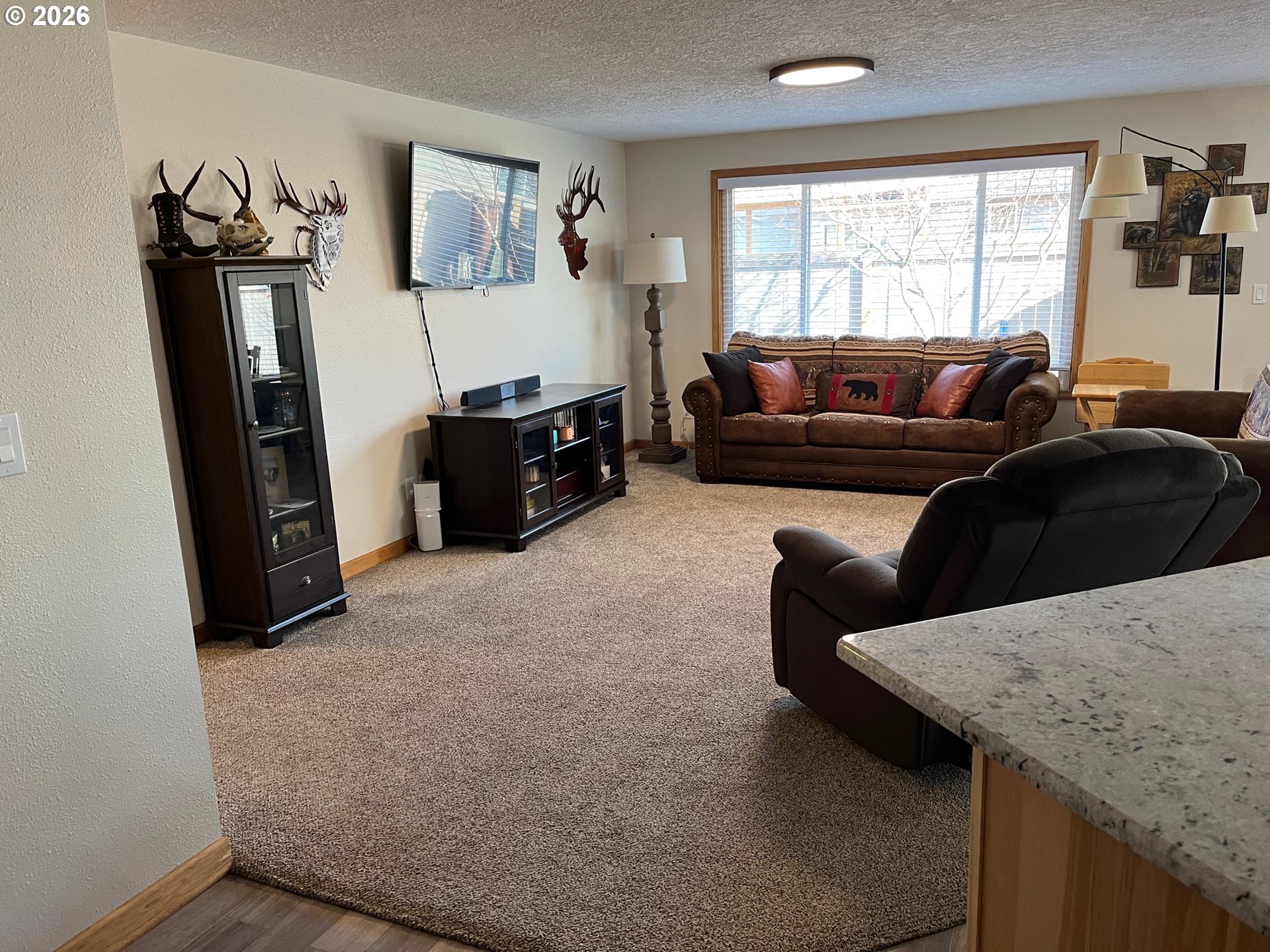 698 South Cascade Drive Woodburn, OR 97071 - Photo 11 of 19 a living room with furniture and a window
