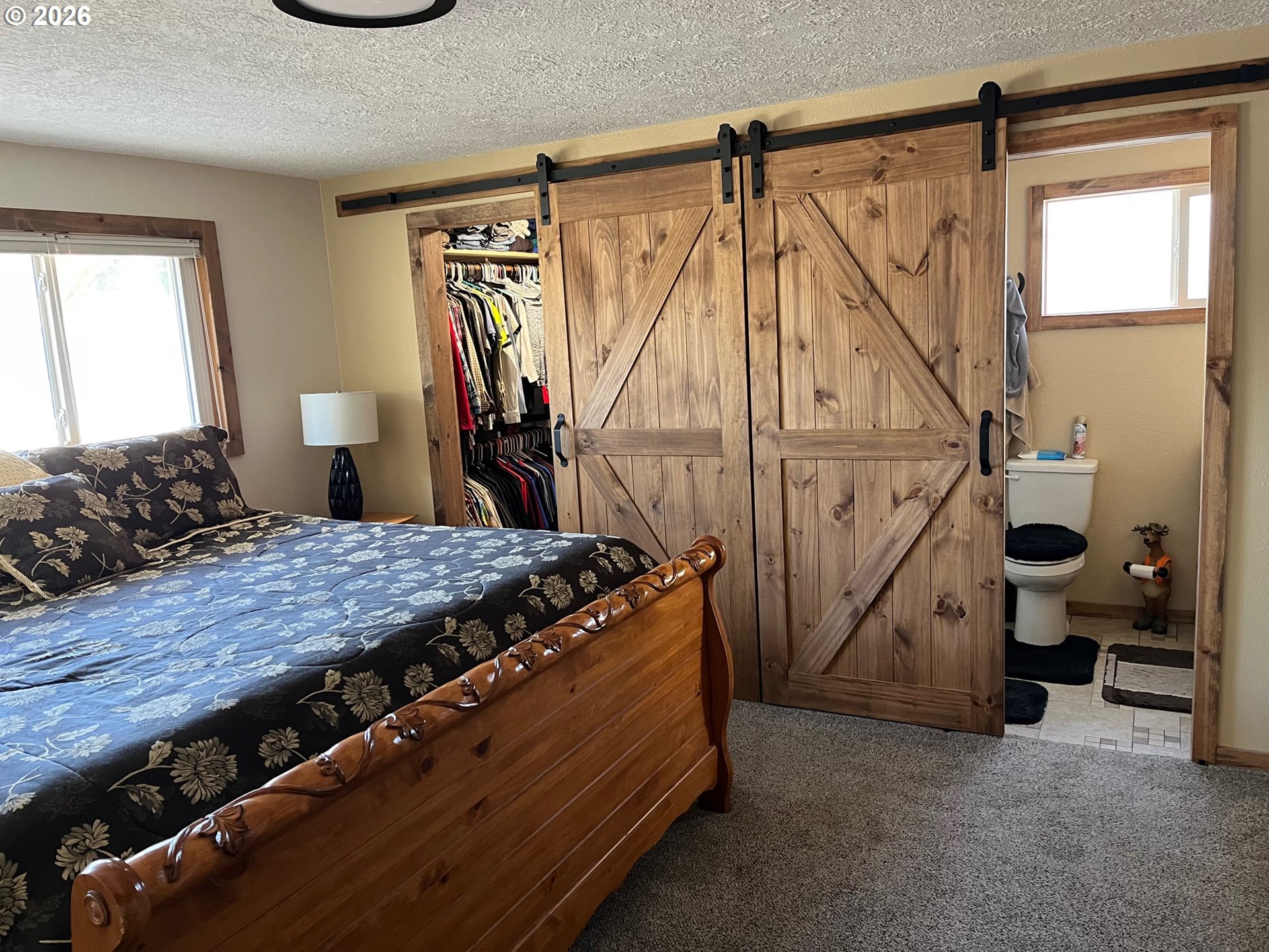 698 South Cascade Drive Woodburn, OR 97071 - Photo 13 of 19 a bed sitting in a room next to a window