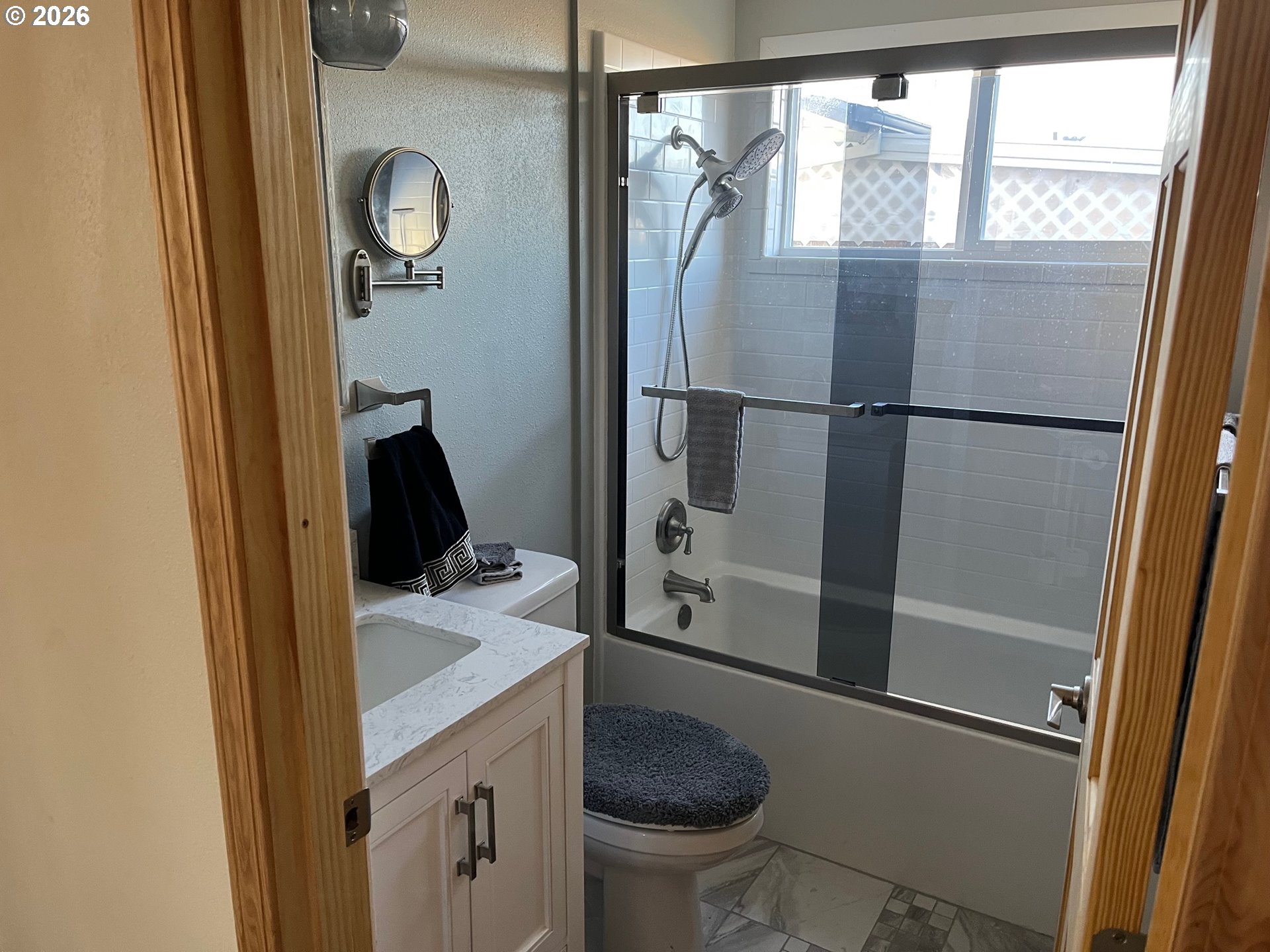 698 South Cascade Drive Woodburn, OR 97071 - Photo 16 of 19 a bathroom with a granite countertop sink toilet and shower