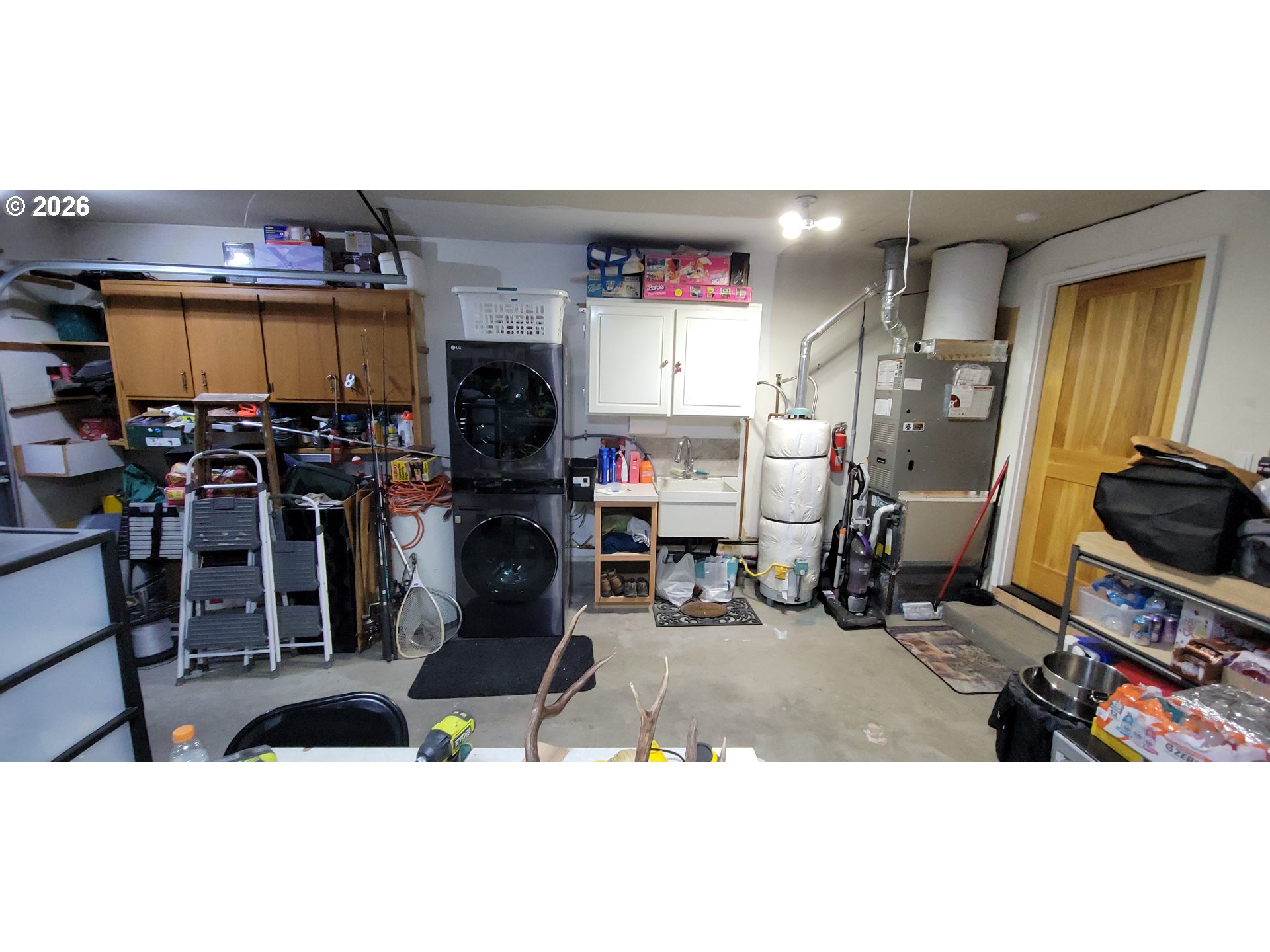 698 South Cascade Drive Woodburn, OR 97071 - Photo 17 of 19 a living room with furniture a flat screen tv and a fireplace