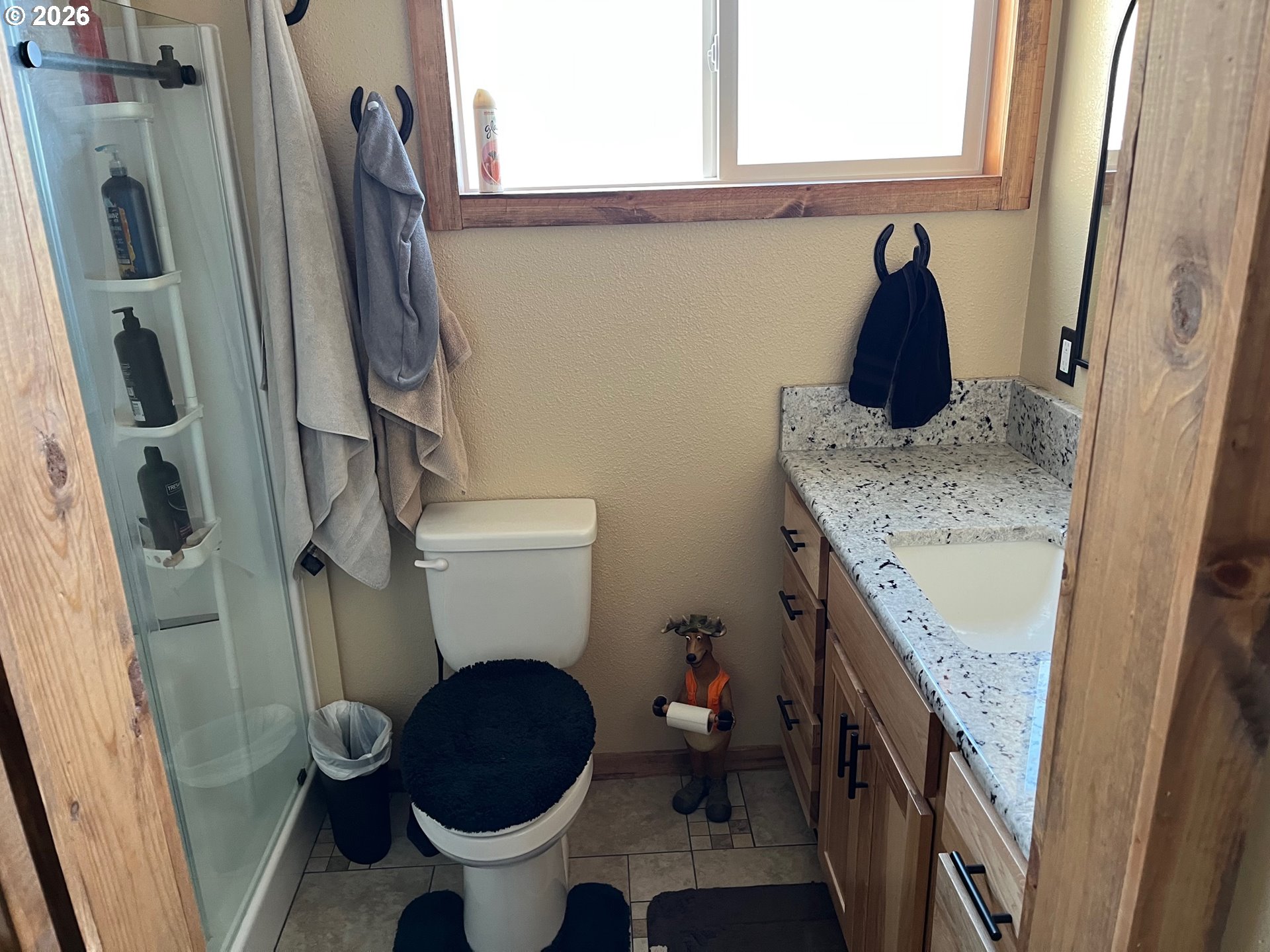 698 South Cascade Drive Woodburn, OR 97071 - Photo 18 of 19 a bathroom with a granite countertop toilet sink and mirror