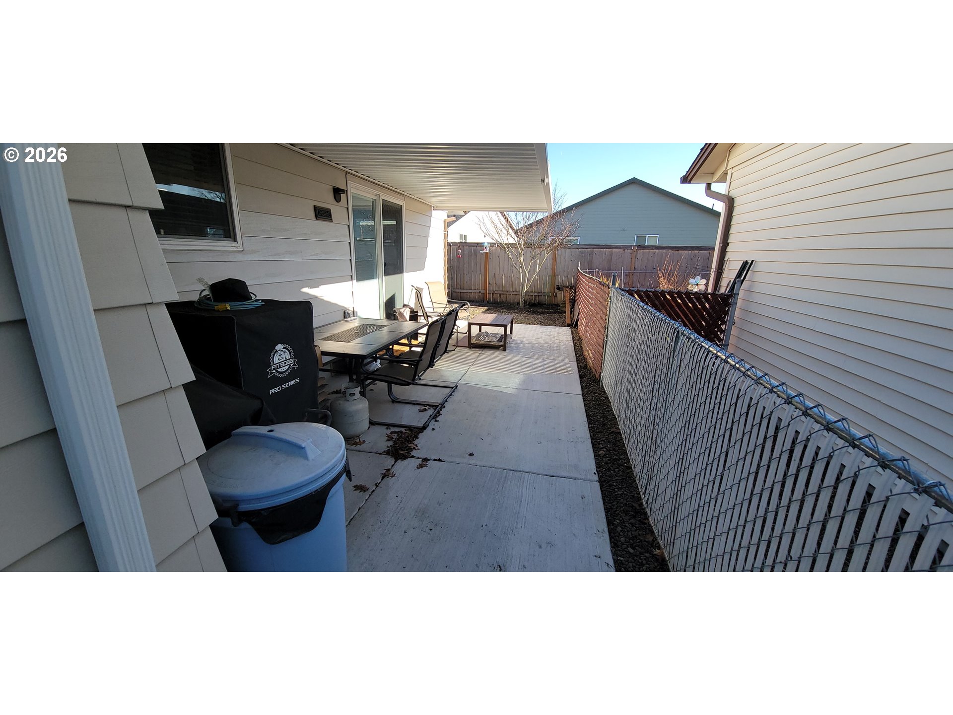 698 South Cascade Drive Woodburn, OR 97071 - Photo 19 of 19 a balcony with couch and chairs