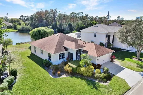 an aerial view of a house with garden space and street view