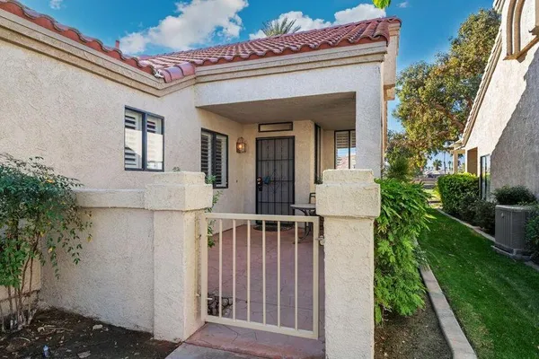 a view of a house with a small yard