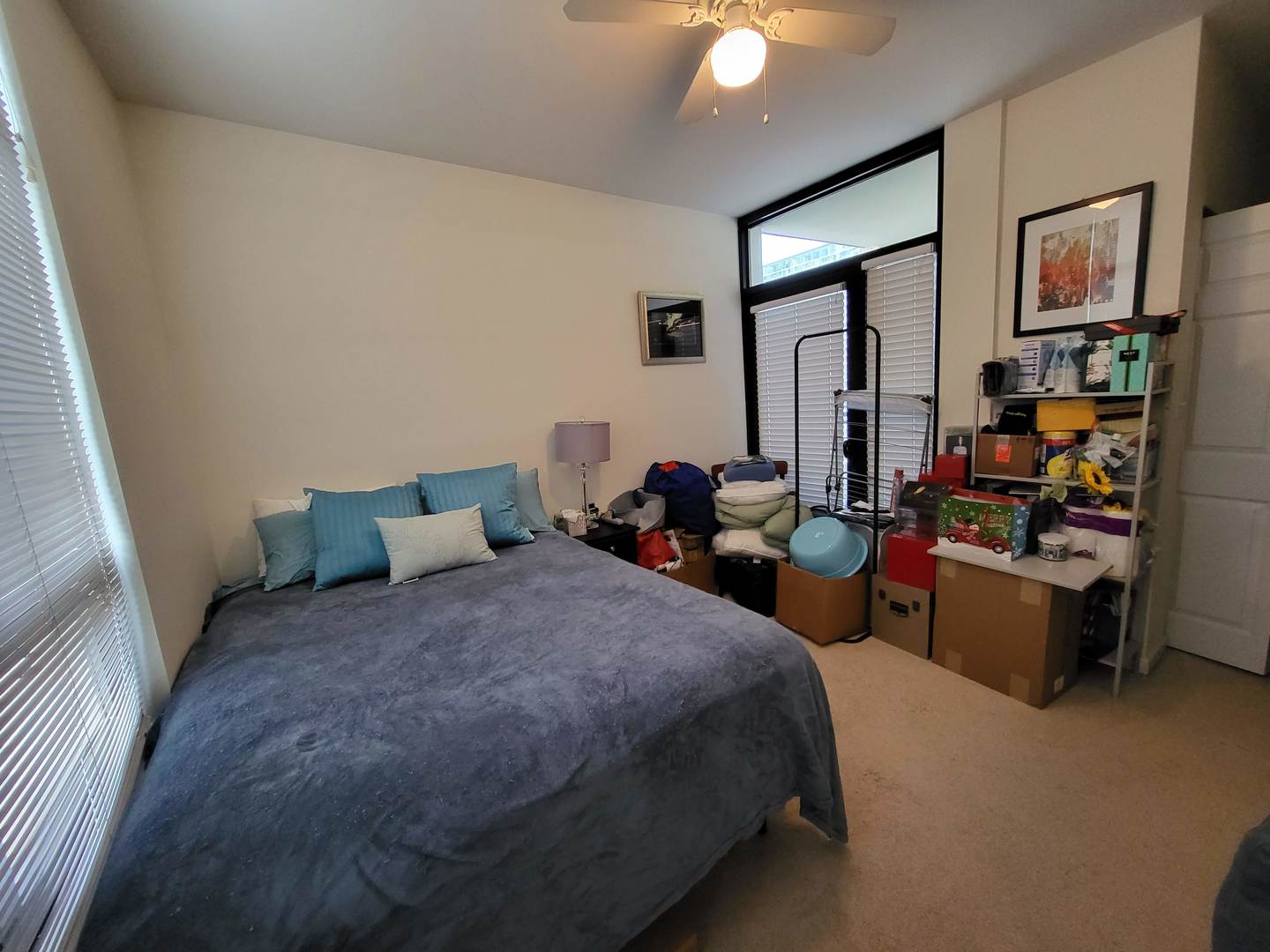 1255 South State Street, Unit 1203 Chicago, IL 60605 - Photo 11 of 21 a bed room with bed and a chandelier