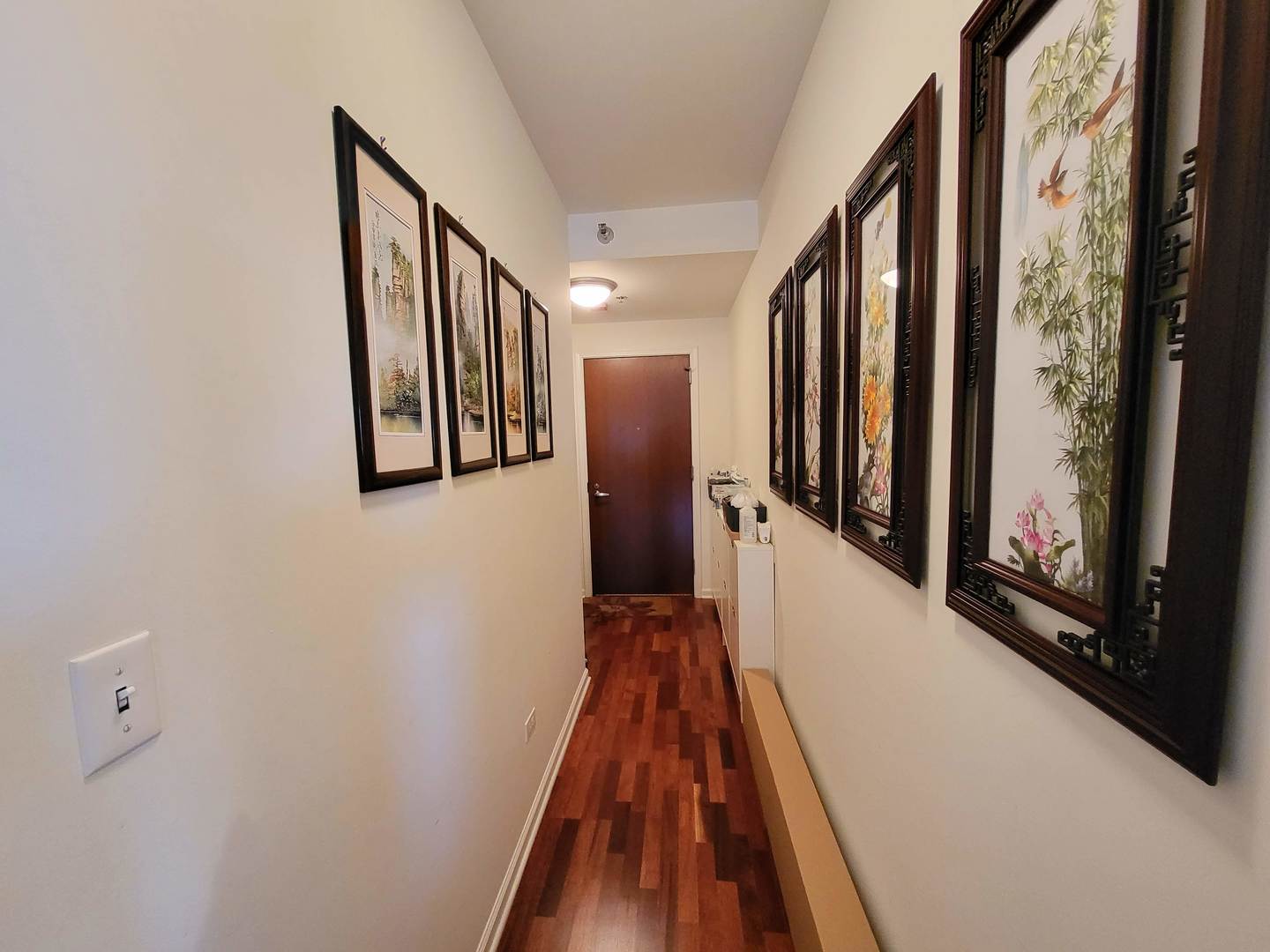 1255 South State Street, Unit 1203 Chicago, IL 60605 - Photo 4 of 21 a view of a hallway with wooden floor and staircase