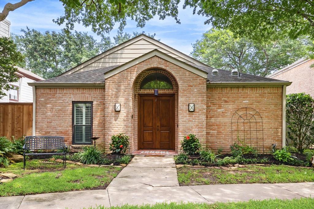 Charming brick home located on a beautiful picturesque courtyard.