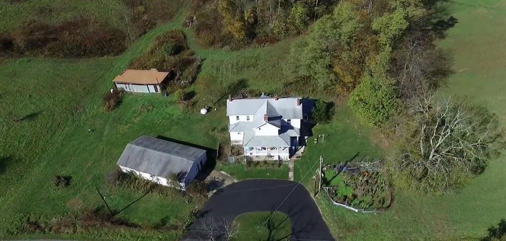 191 Pyle Road Jefferson, PA 15344 - Photo 1 of 24 an aerial view of a house with a garden