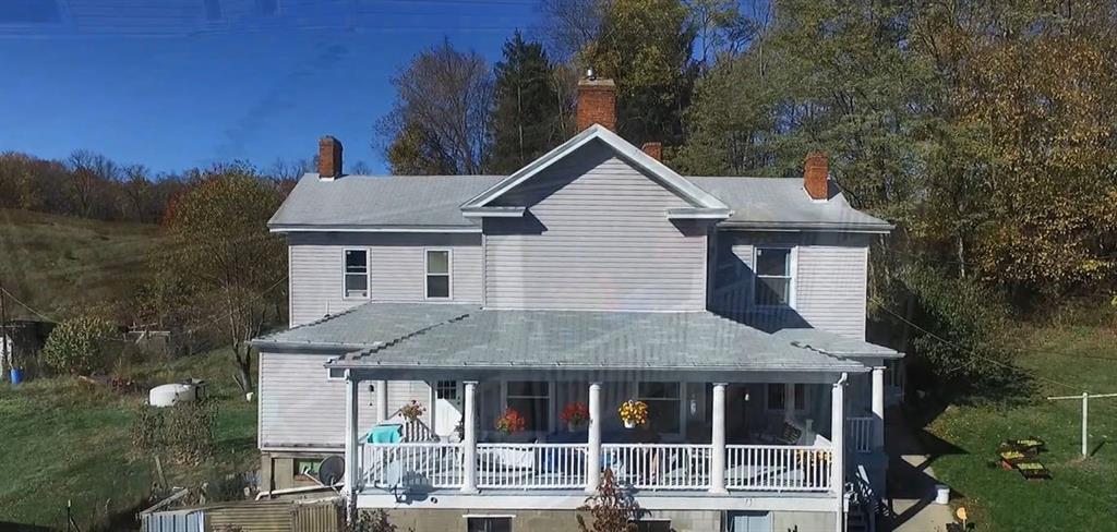 191 Pyle Road Jefferson, PA 15344 - Photo 2 of 24 a aerial view of a house with a yard and potted plants